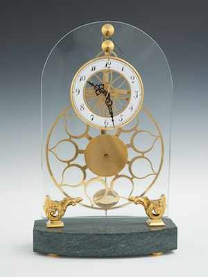 Appraisal: A Great Wheel Skeleton Clock With an enameled face lacquered