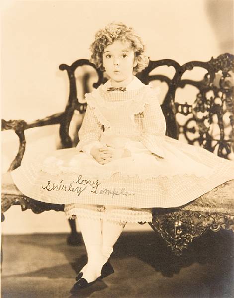 Appraisal: A Shirley Temple sepia signed photograph s A vintage print