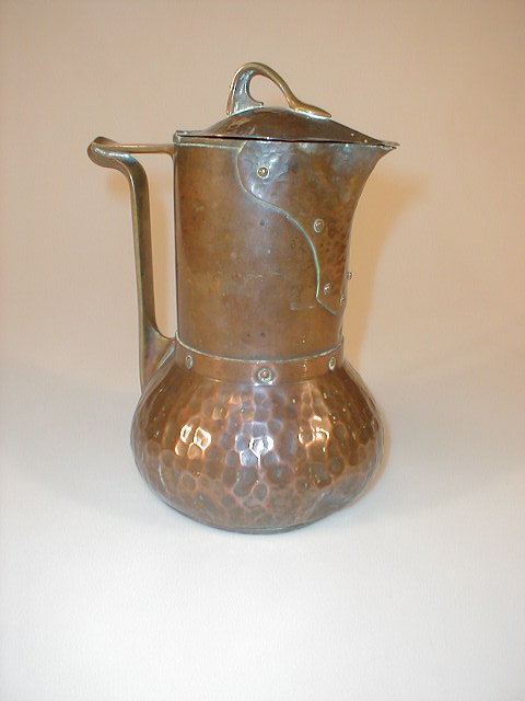 Appraisal: An Arts Crafts copper jug and cover the domed cover