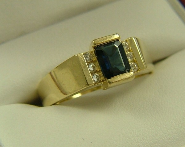 Appraisal: SAPPHIRE DIAMOND AND FOURTEEN KARAT GOLD RING set with an