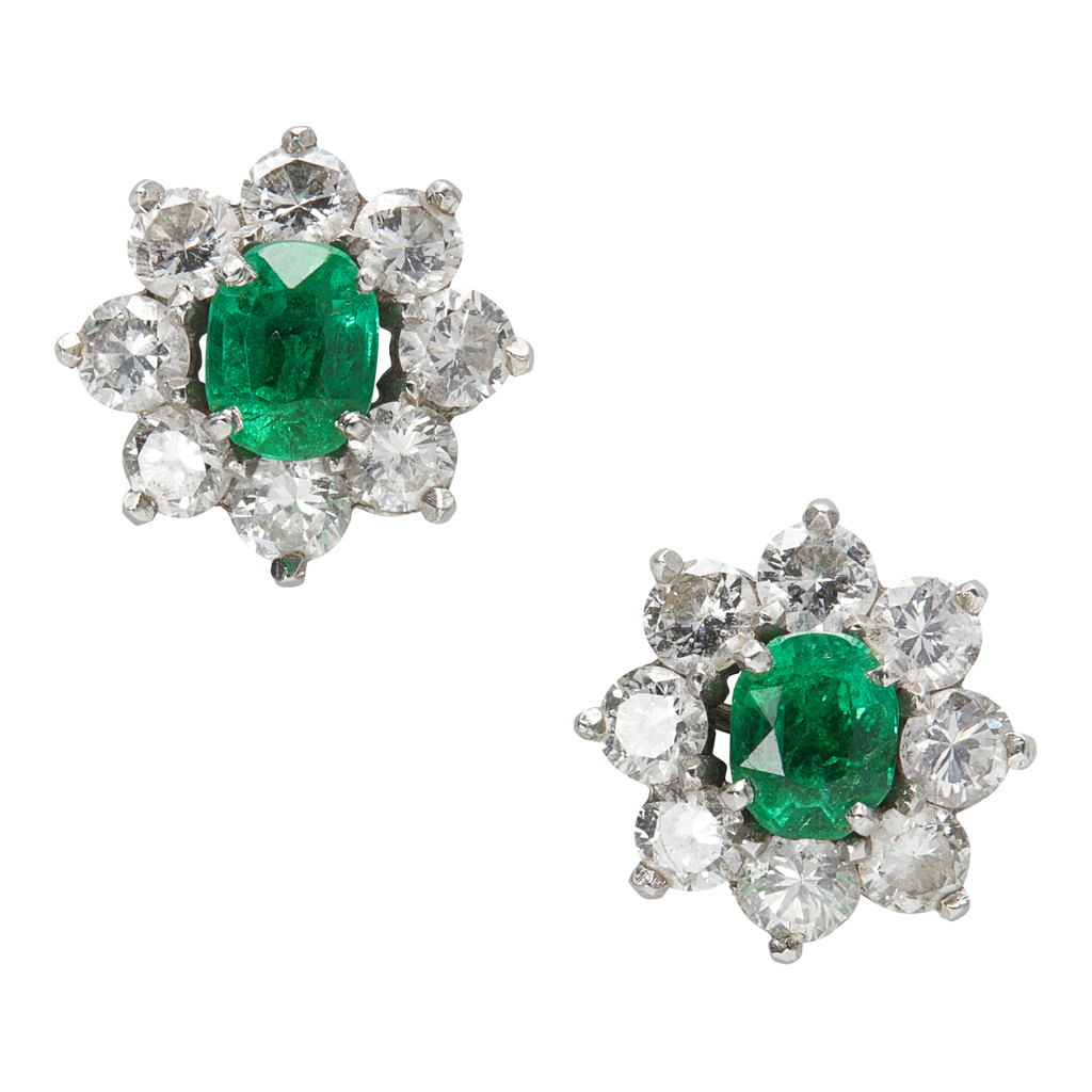 Appraisal: A pair of emerald and diamond cluster earrings each claw