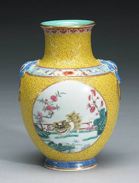 Appraisal: A yellow ground porcelain baluster vase with famille rose decoration