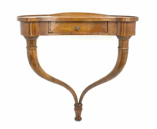 Appraisal: A Continental Mahogany Wall Shelf in the form of a