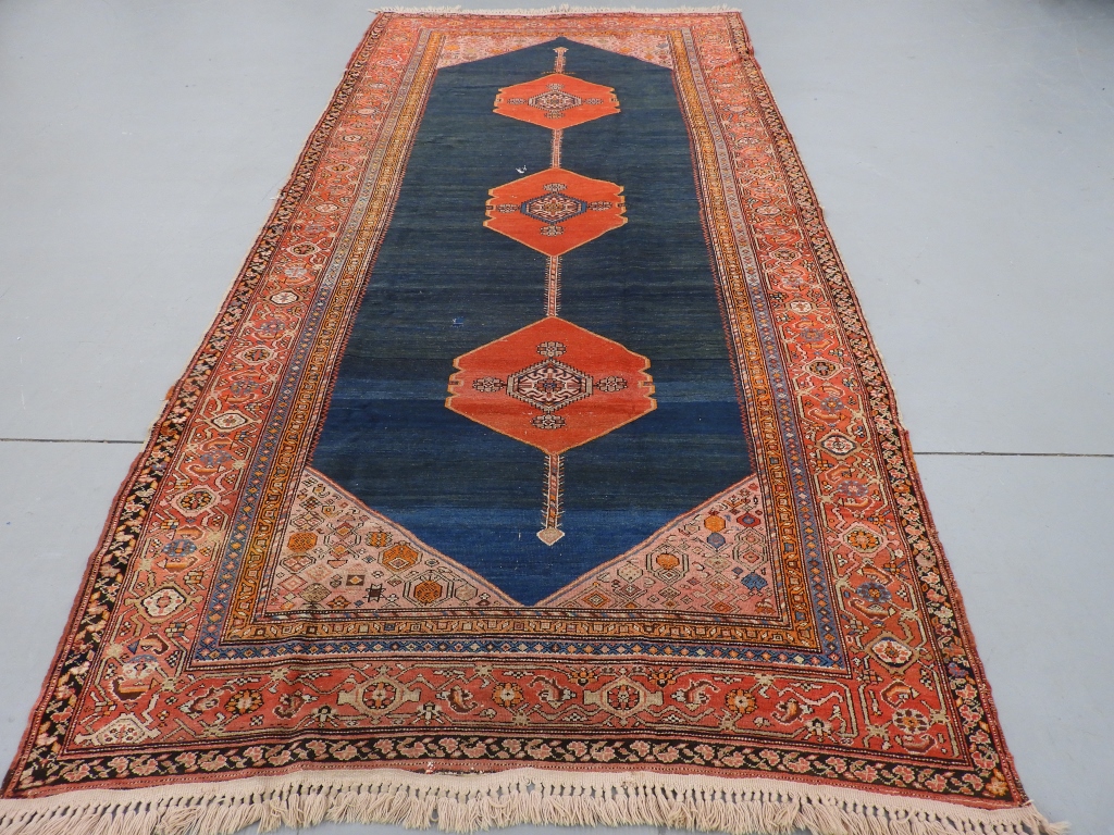 Appraisal: ANTIQUE BIDJAR RED MEDALLION CARPET PersiaFirst quarter th CenturyThree red