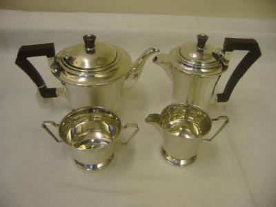 Appraisal: A FOUR PIECE TEA SET of circular form with tapering