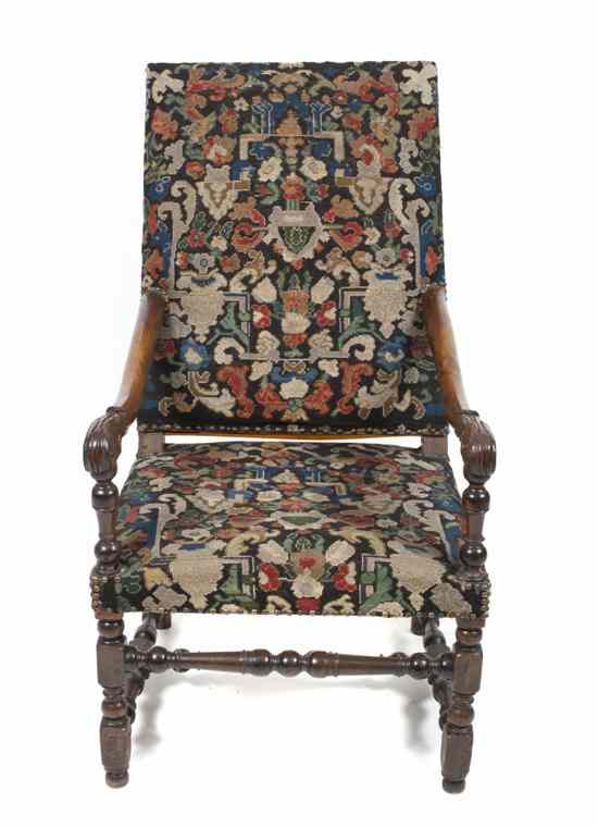 Appraisal: A Flemish Baroque Walnut Armchair having a rectangular back and