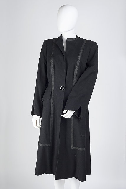 Appraisal: A lady's black coat with black ribbon trim full length