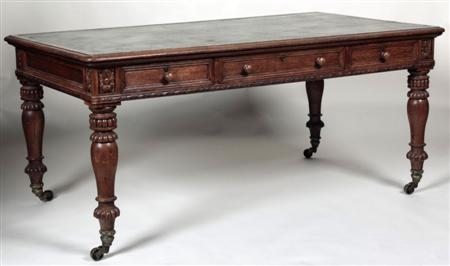 Appraisal: A late Victorian ornate carved oak library table the moulded