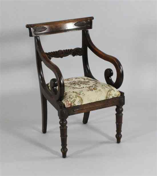 Appraisal: A Regency carved beech child's armchair on ring turned tapered