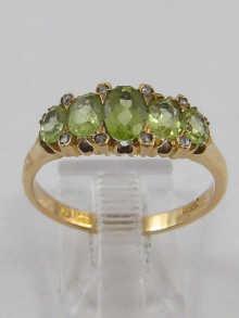 Appraisal: A hallmarked carat gold stone peridot and diamond ring Birmingham