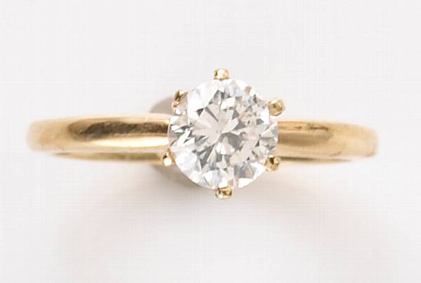 Appraisal: A diamond and k gold solitaire ring diamond weighing an