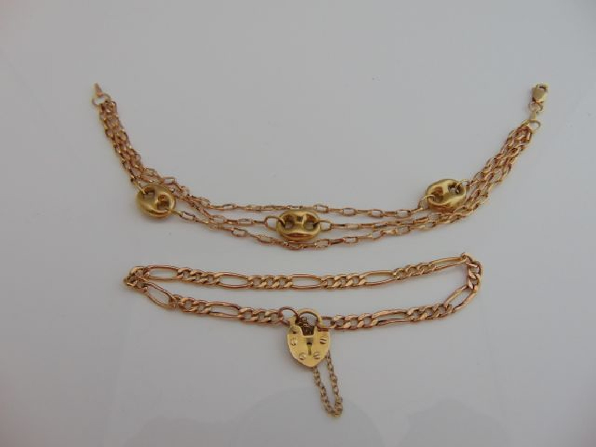 Appraisal: A ct gold bracelet with heart-shaped padlock clasp g and