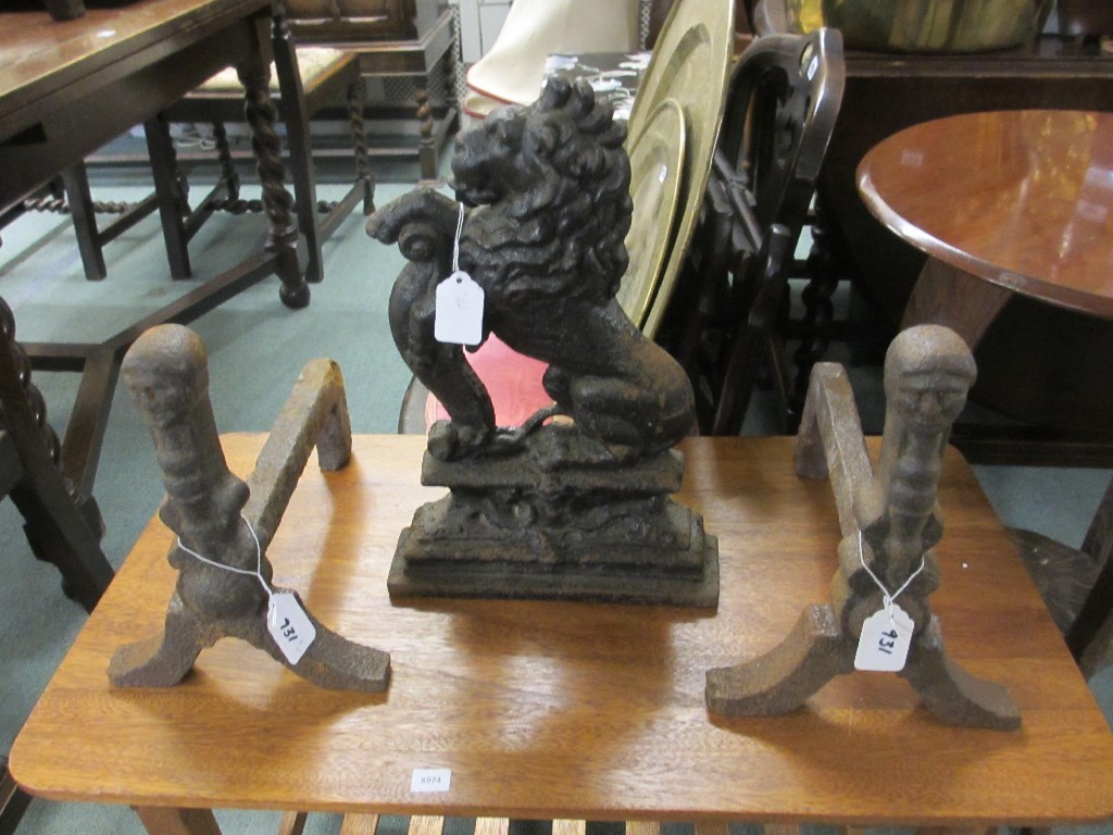 Appraisal: Victorian cast iron doorstop and a pair of fire dogs