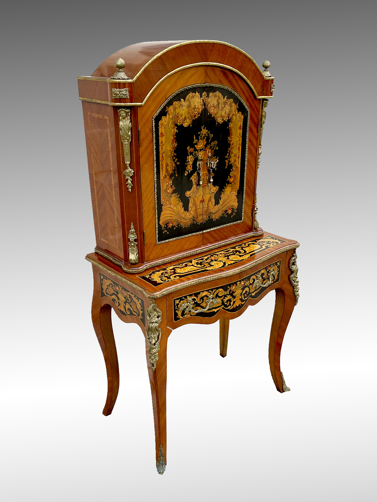 Appraisal: ITALIANATE STYLE ORMOLU MOUNTED DESK CABINET Faux inlaid Painted foliate