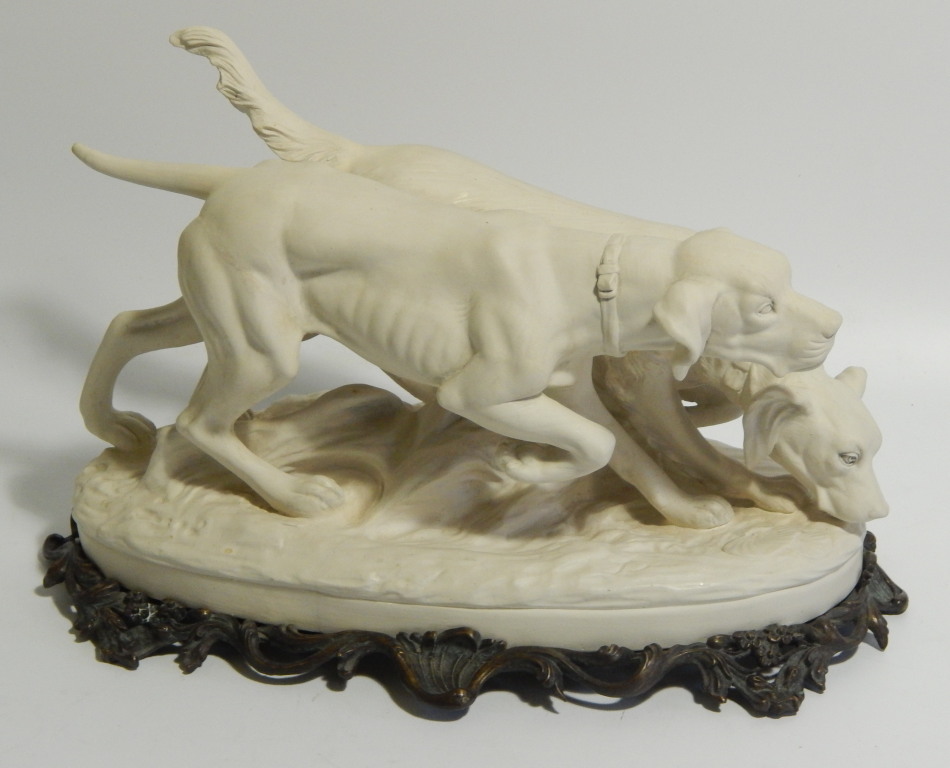 Appraisal: A Weldon Pottery bisque figure group of a pointer and