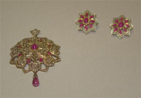 Appraisal: PAIR OF RUBY AND DIAMOND PENDANT EAR CLIPS The star-shaped