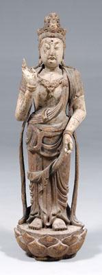 Appraisal: Chinese carved wood figure of Guanyin wearing elegantly knotted and