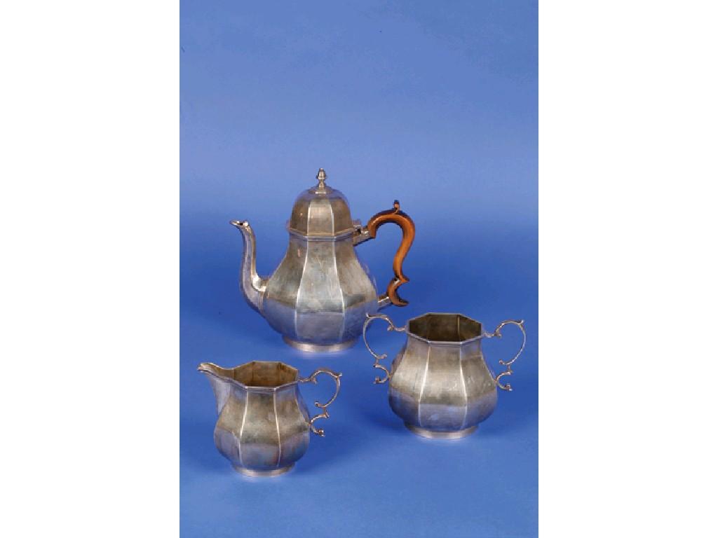 Appraisal: A THREE PIECE TEA SET of octagonal form with scroll