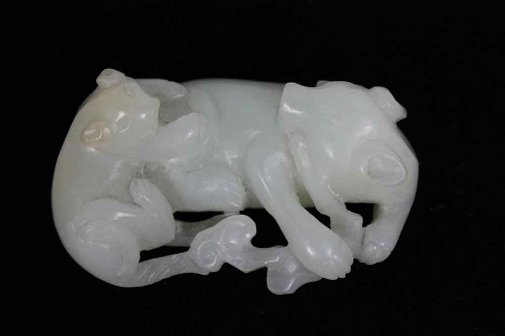 Appraisal: CHINESE WHITE JADE CARVING OF A SOW AND PIGLET QING