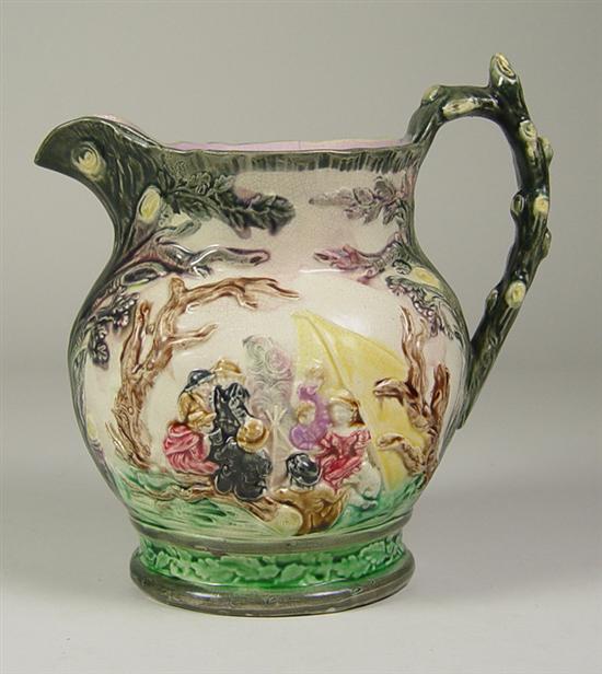 Appraisal: Majolica Earthenware Pitcher Scenic pitcher with woodsy modeling Figures are