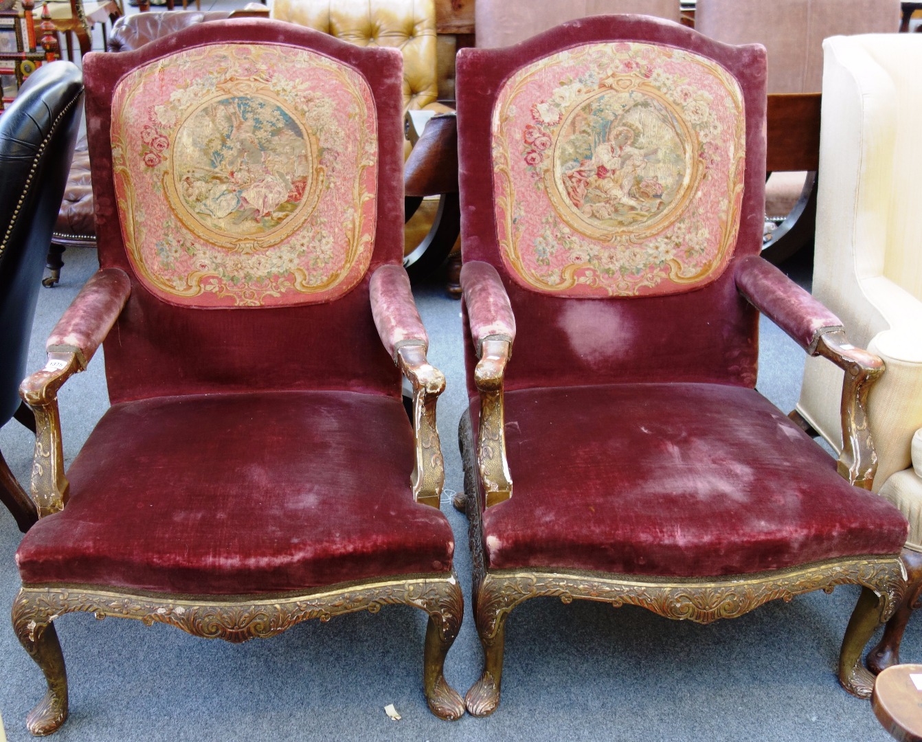 Appraisal: A pair of early th century gilt framed open armchairs