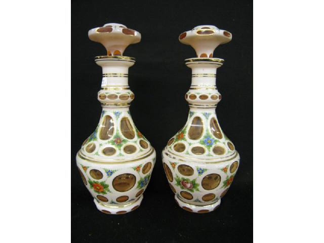 Appraisal: Pair of Bohemian Cut Back Decanters white cased cut to