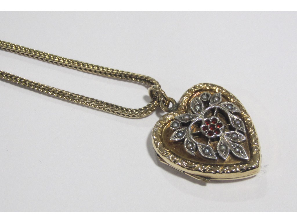 Appraisal: Rolled gold heart shaped locket with silver foliate onlay set