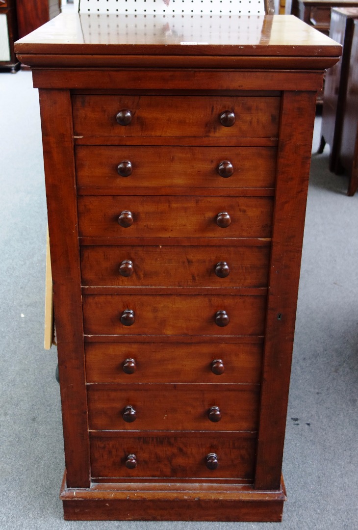 Appraisal: A Victorian mahogany Wellington chest the side locking bar enclosing