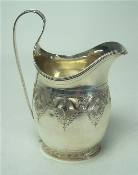 Appraisal: A George III helmet formed cream jug P A Bateman