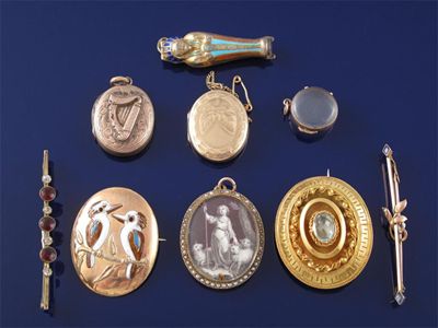 Appraisal: An oval locket painted with a shepherdess within seed pearl