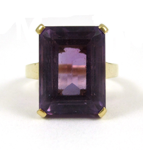 Appraisal: AMETHYST AND FOURTEEN KARAT GOLD RING set with a large