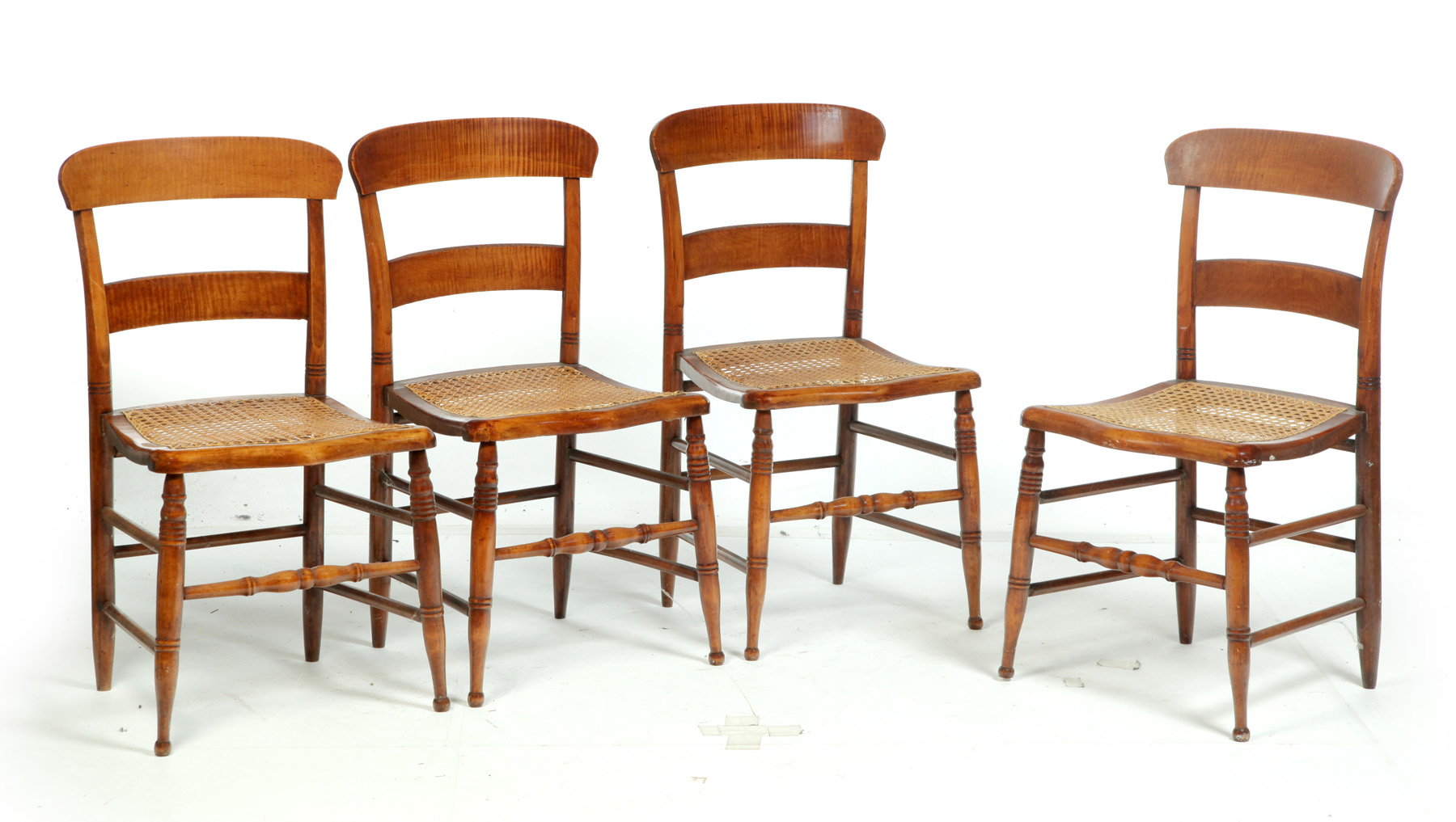 Appraisal: SET OF FOUR TIGER MAPLE CANE-SEAT CHAIRS American rd quarter-