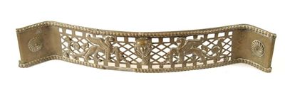 Appraisal: An early th century serpentine pierced brass fender with applied