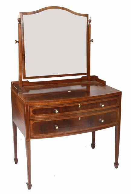 Appraisal: AN EDWARDIAN SHERATON STYLE MAHOGANY BOW FRONTED DRESSING TABLE with