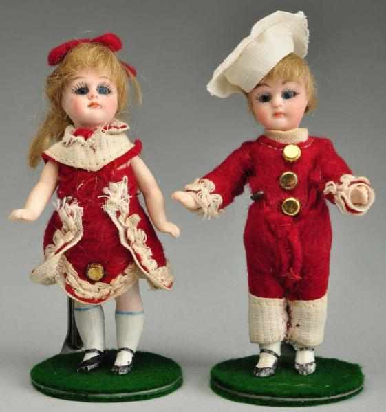 Appraisal: Pair of All Bisque Twin Dolls Description Both are incised