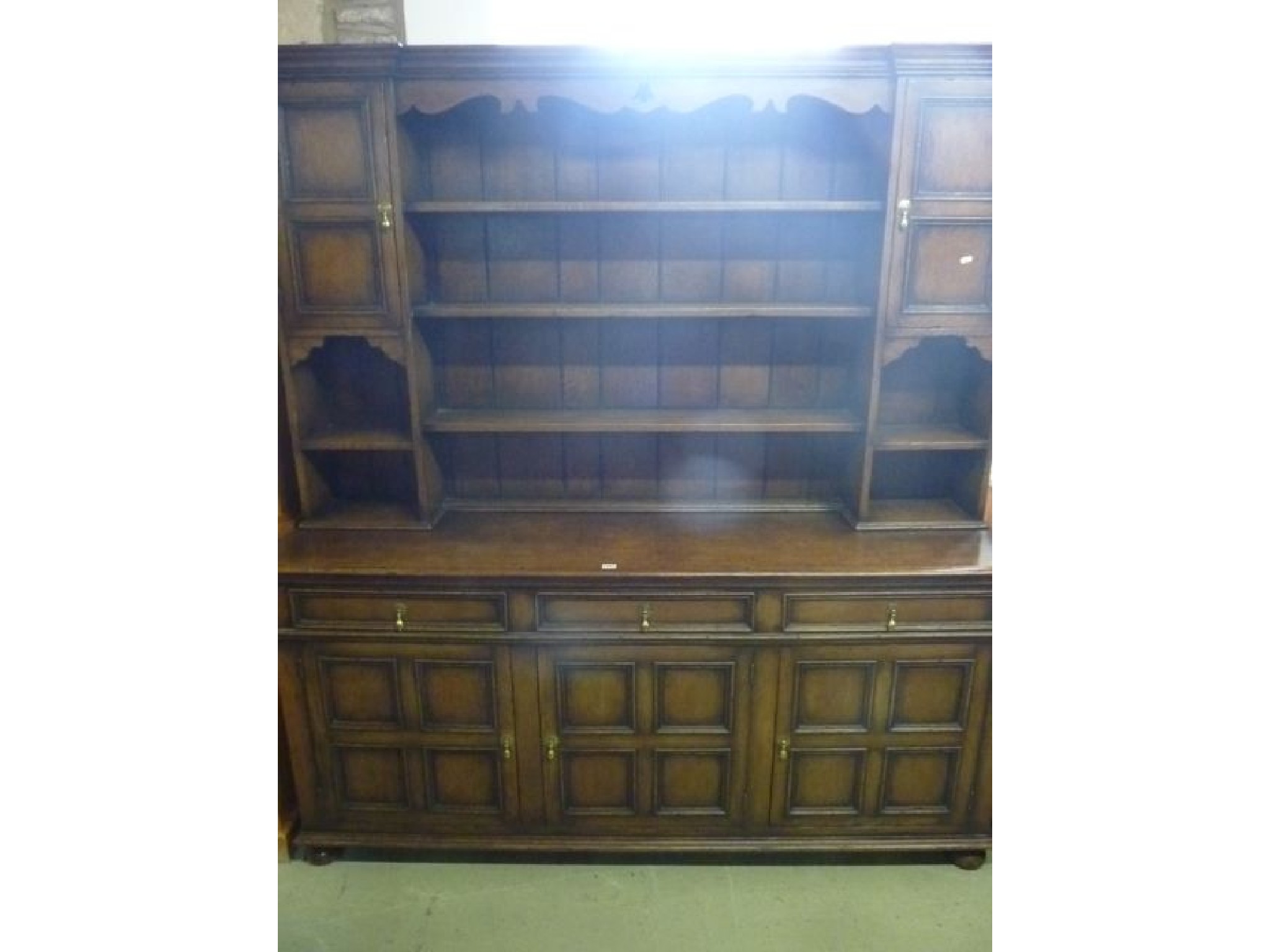 Appraisal: A good quality reproduction oak dresser in the Old English