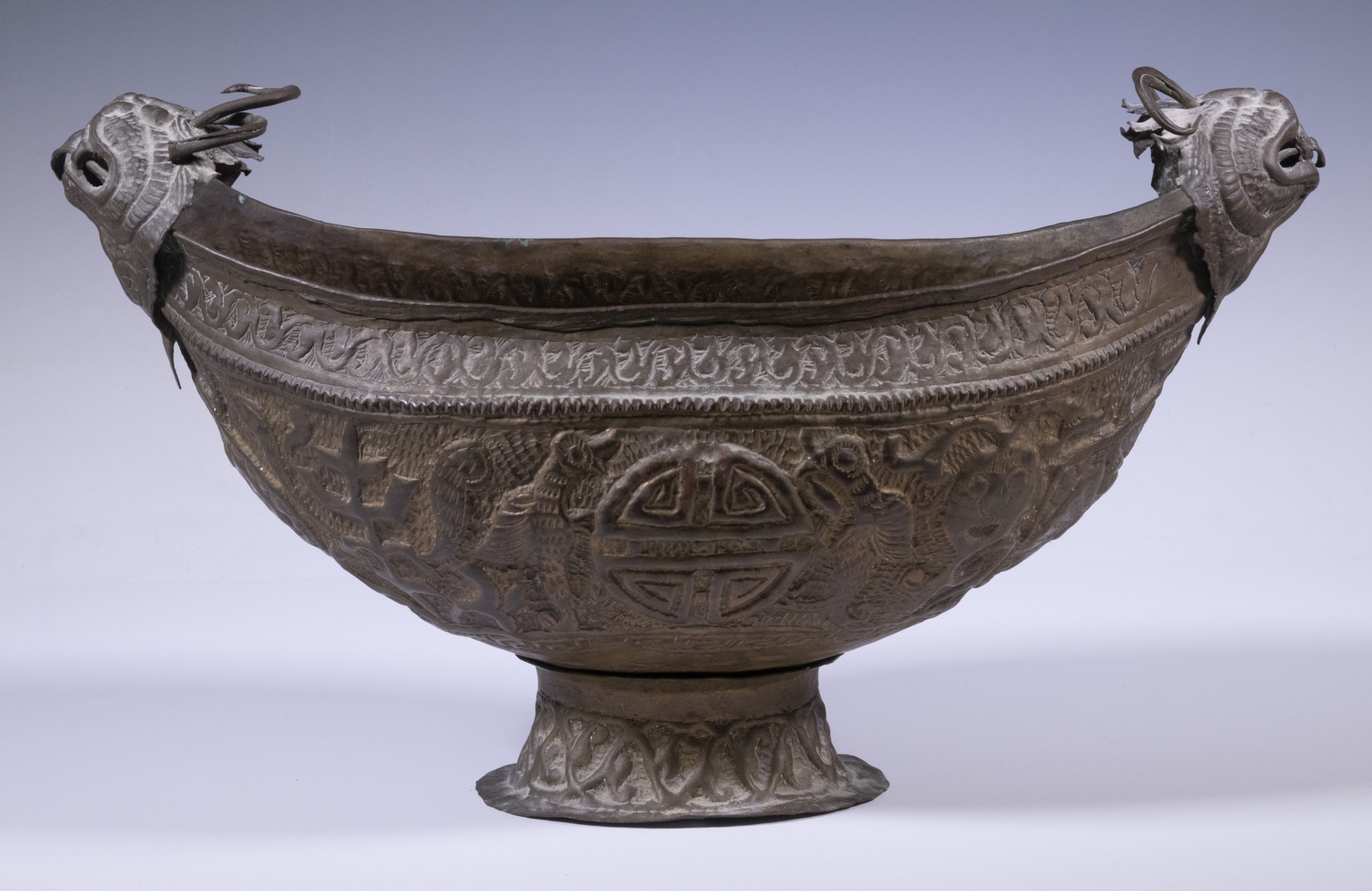 Appraisal: KASHMIRI COPPER REPOUSSE FOOTED BOWL Crescent Shaped Embossed Bowl possibly