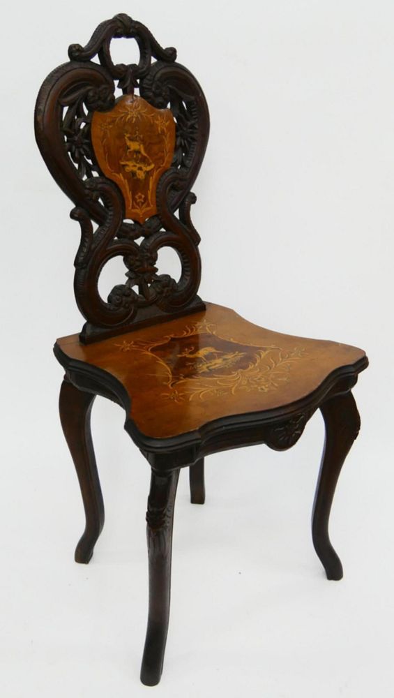 Appraisal: CARVED ANTIQUE ENGLISH MUSIC CHAIR MOOSE MOTIF th century all