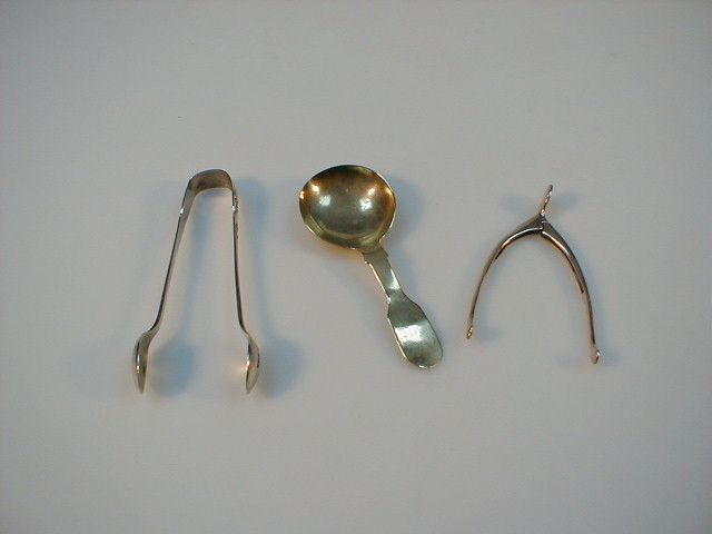 Appraisal: A pair of silver sugar nips plated caddy spoon and