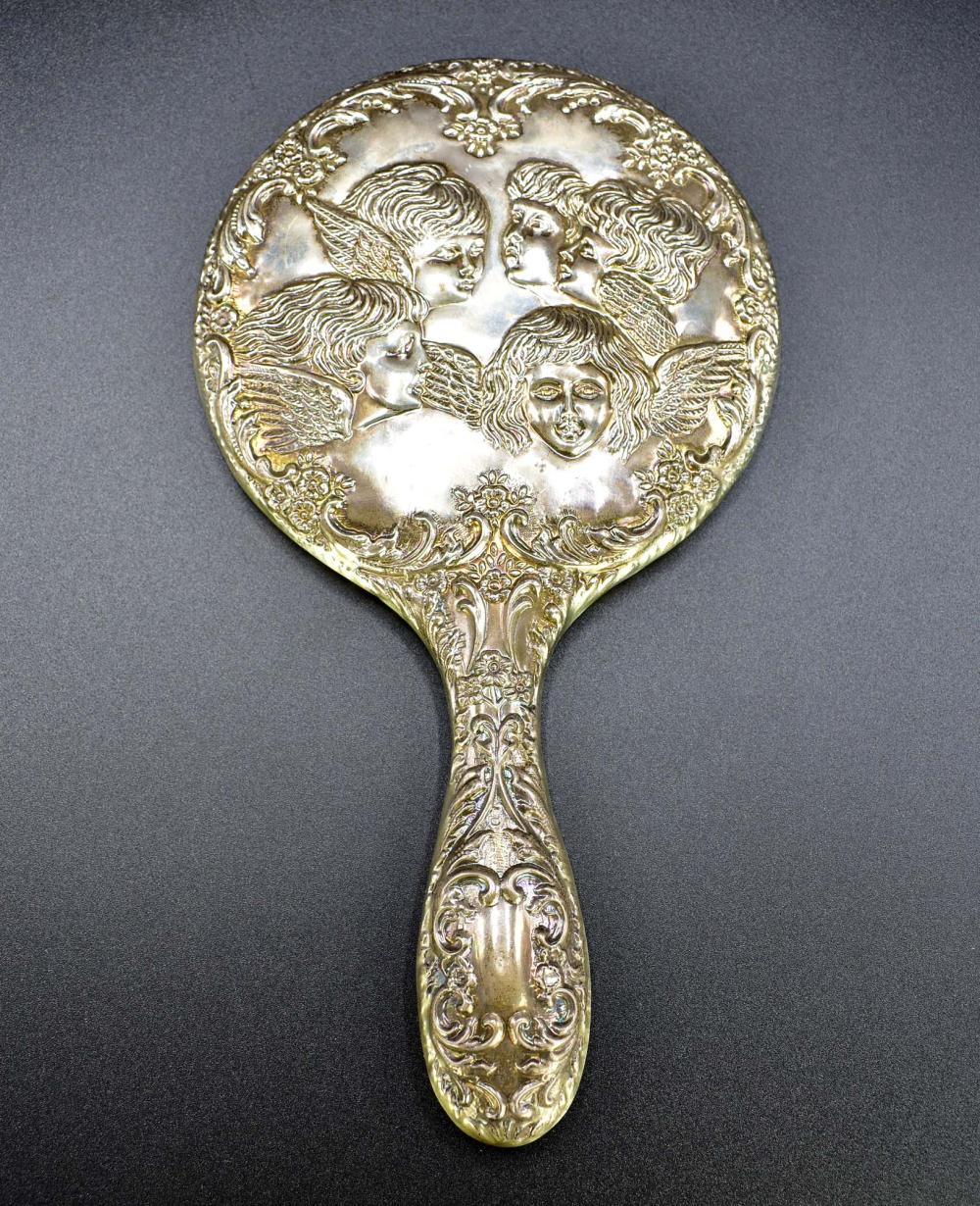 Appraisal: VICTORIAN SIVER PLATE HAND MIRRORIn a Renaissance Revival style chased