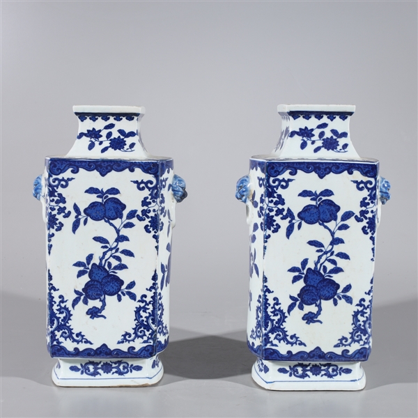 Appraisal: Pair of blue and white porcelain vases with molded animal