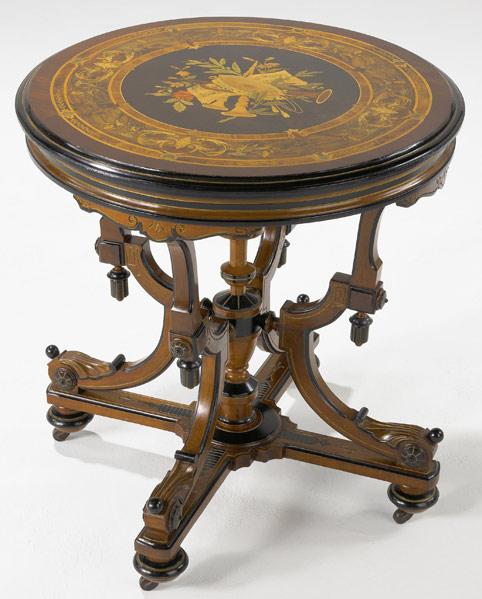 Appraisal: VICTORIAN HALL TABLE With marquetry circular top ebonized decoration and