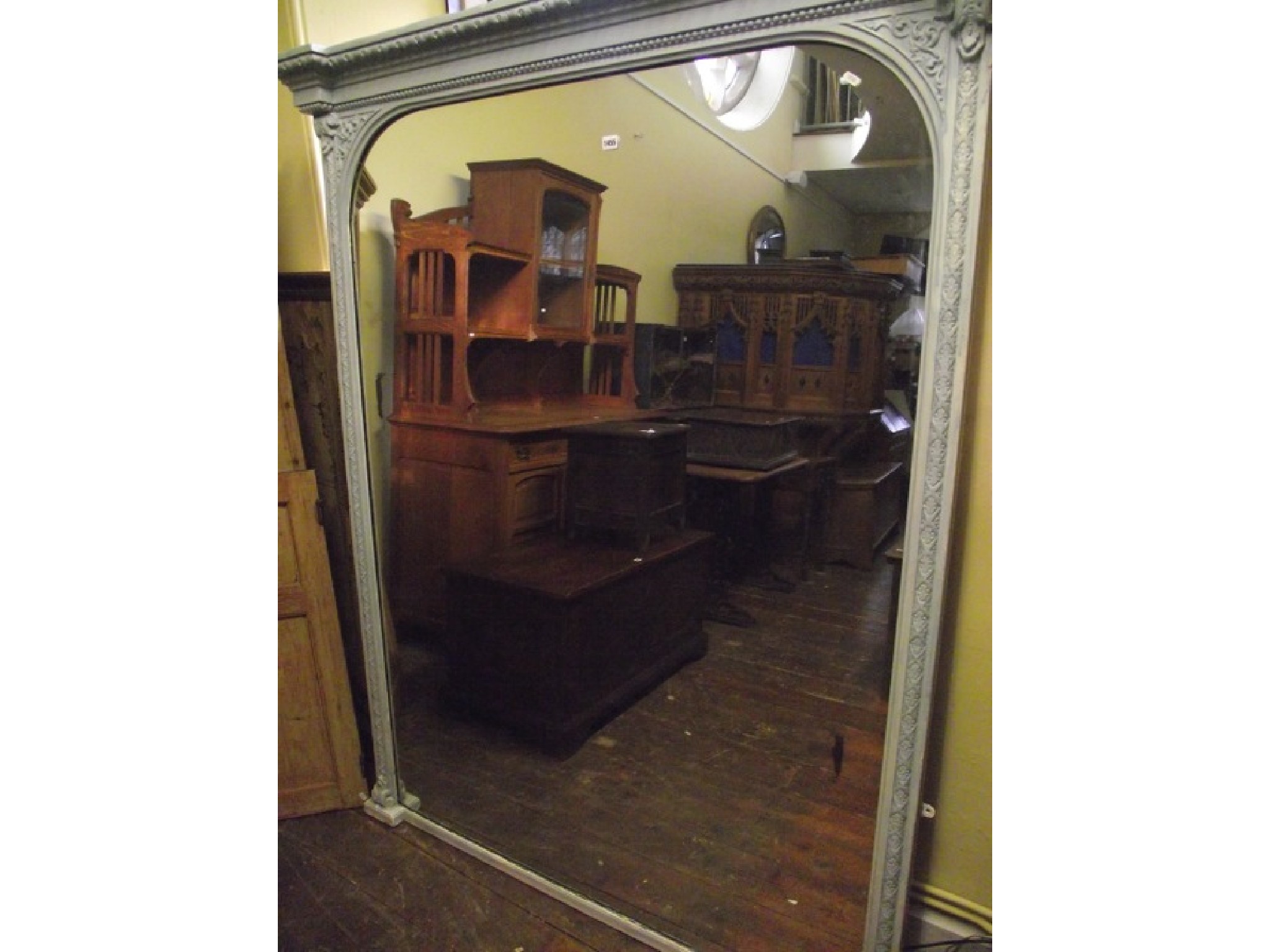 Appraisal: A substantial th century over mantle mirror the moulded frame