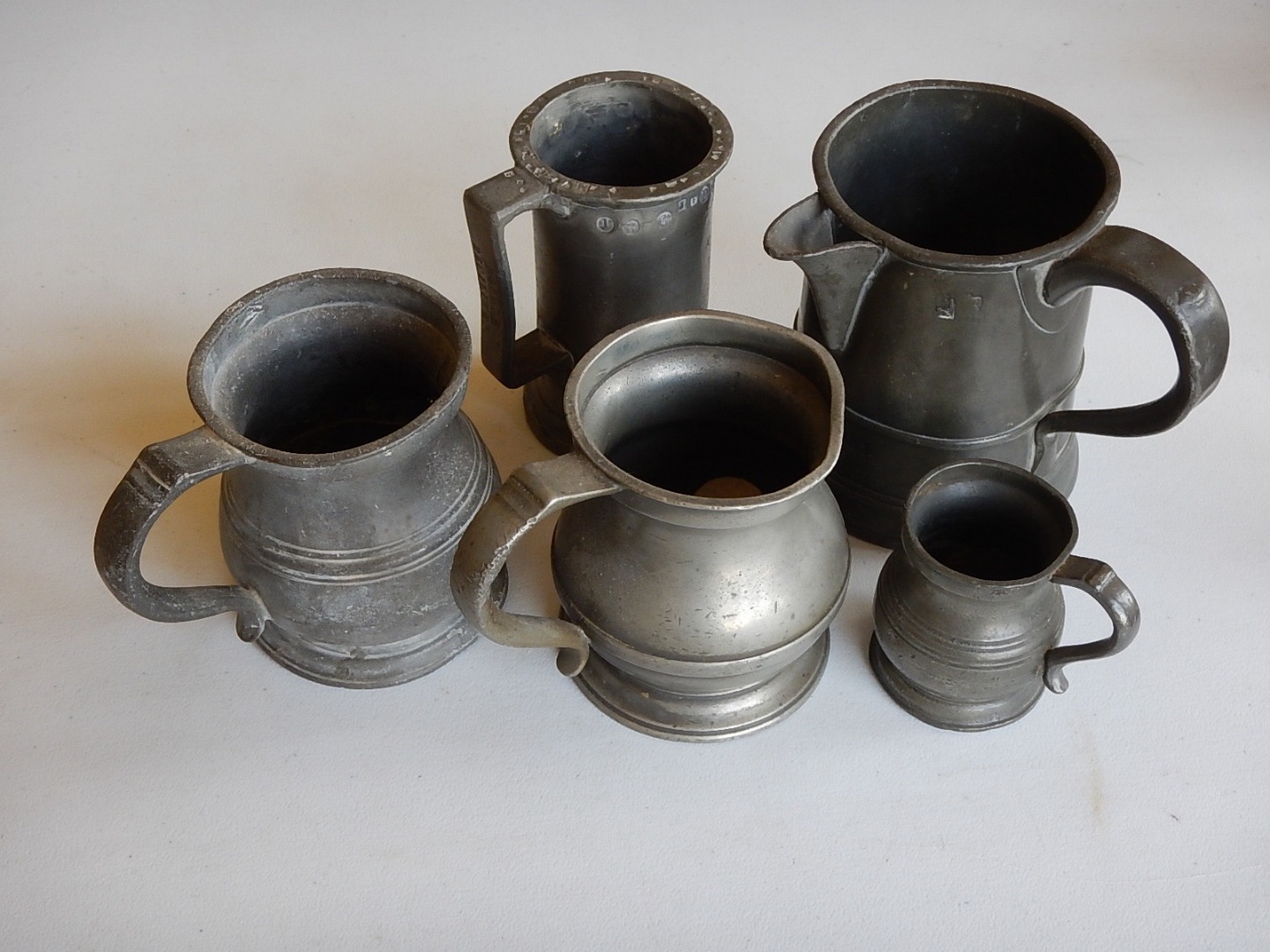 Appraisal: A collection of thC thC pewter measures and a jug