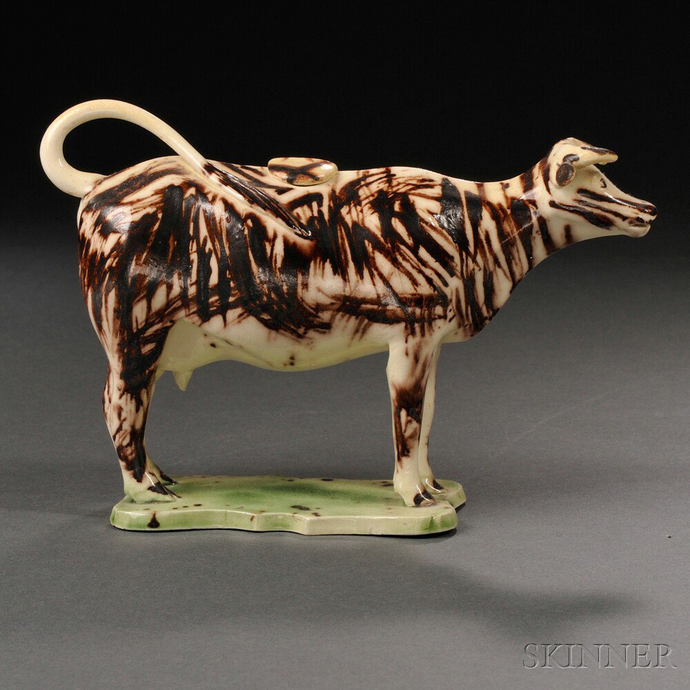 Appraisal: Staffordshire Cream-colored Earthenware Cow Creamer England c allover manganese striping