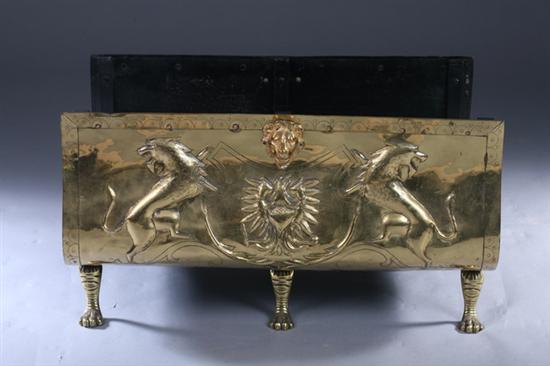 Appraisal: BRASS U-FORM LOG HOLDER th century With gilt-metal lion mask