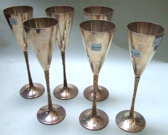 Appraisal: Six silver champagne flutes the stems with gilt decoration on