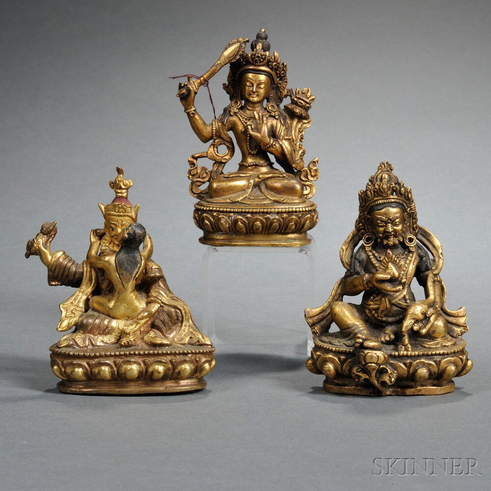 Appraisal: Three Small Gilt-bronze Seated Buddhist Figures China Kubera holding a