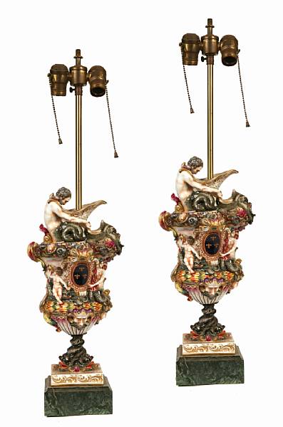 Appraisal: A pair of Capodimonte porcelain ewers now mounted as table