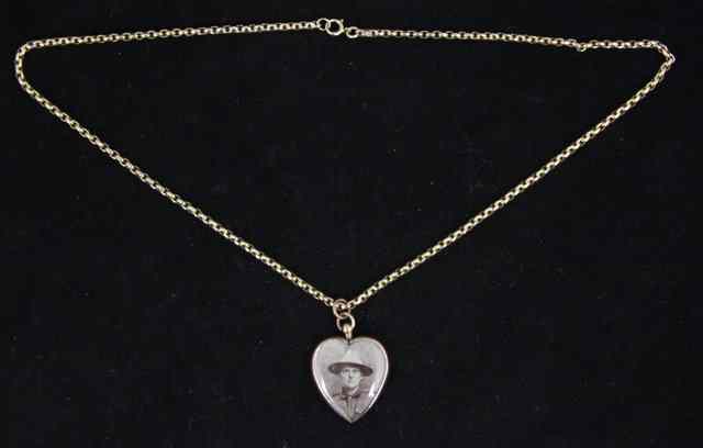 Appraisal: A ct rose gold framed heart-shaped locket on a ct